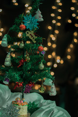 Decorated christmas tree with the bokeh background of round light