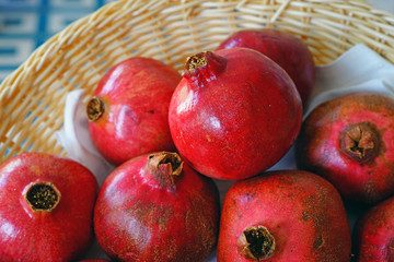 Basket of red pomegranate fruit