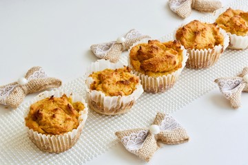 Tasty pumpkin spice cupcakes on the white table