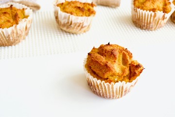 Tasty pumpkin spice cupcakes on the white table