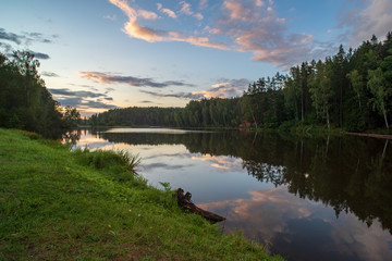 blue sky white clouds over calm body of water