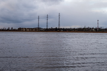lakeside beach details with sand, rocks and blur background