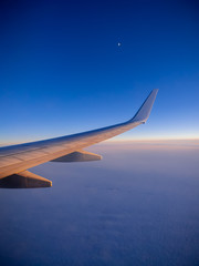 Moon rising over the wing