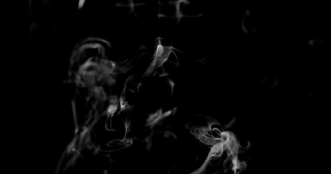 Smoke background. White smoke floating through space against black background