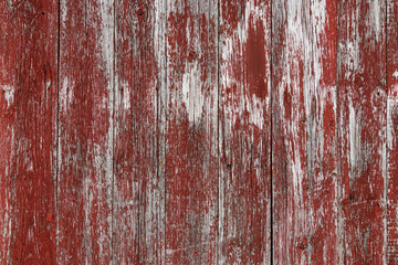 Wooden wall with worn red paint