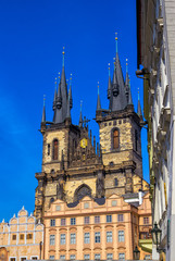 Fototapeta premium Cityscape of Prague, Czech Republic – view of Church of Our Lady before Tyn over blue sky. Gothic architecture.