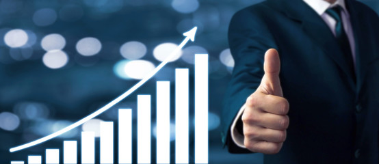 Businessman showing thumbs up sign. Growth graph. Success concept