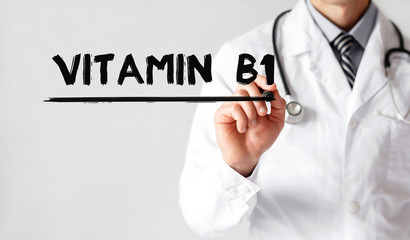 Doctor writing word Vitamin  b1 with marker, Medical concept