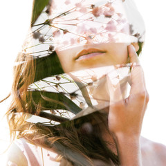 Double exposure portrait of a young sexy girl with flawless skin combined with delicate flower...