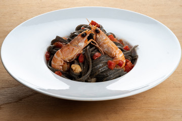 Scampi and balck fetuccine