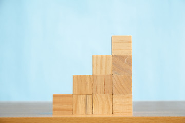 Wood block stacking as step stair.business growth to success.