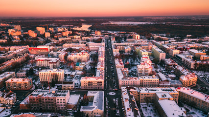 Fototapeta na wymiar Beautiful sunset on the background of a European city with a copter. Gomel. Belarus.
