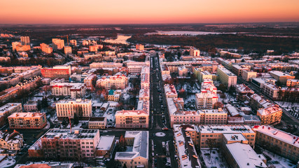 Obraz premium Beautiful sunset on the background of a European city with a copter. Gomel. Belarus.
