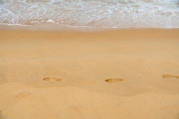 Fototapeta na wymiar People leave footprints in the sand.