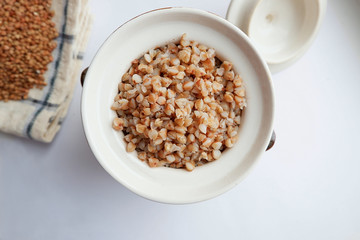 Soaked buckwheat in a clay pot, top view