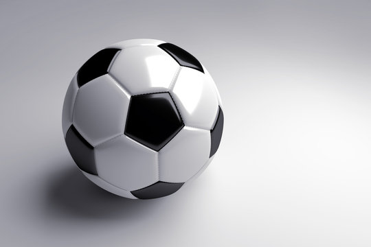 black and white soccer ball with shadow on gray background. 3d render.
