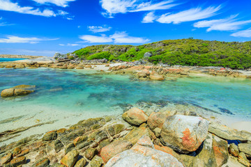 Scenic Madfish Island has the best William Bay rock pools. William Bay NP, Albany region, Western Australia. Sunny day with blue sky. Popular summer destination in Australia.