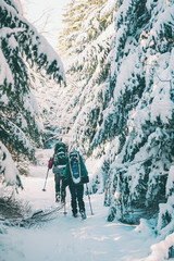 Two women in a winter hike.
