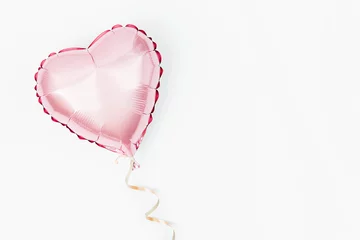 Deurstickers Single Balloon of heart shaped foil on white background. Love concept. Holiday celebration. Valentine's Day or wedding/bachelorette party decoration. Metallic balloon © igishevamaria
