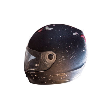 Scratched black motorcycle full face helmet side view isolated on white
