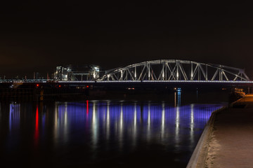 Fototapeta na wymiar Oude IJssel bridge with the railway bridge at Zutphen at night