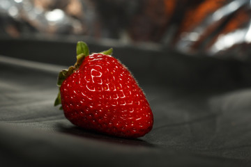 Fresh red strawberry isolated on a black background