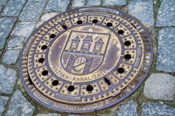 Fototapeta na wymiar Prague, Czech Republic, metal sewer cover