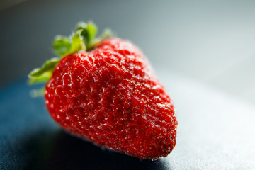 Fresh red strawberry isolated on a black background
