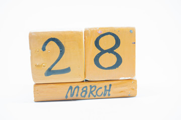 march 28th. Day 28 of month, handmade wood calendar isolated on white background. Spring month, day of the year concept.