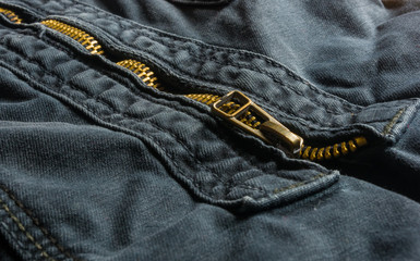 clothing items washed cotton fabric texture with seams, clasps, buttons and rivets