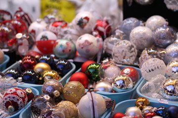 Assortment of balls toys for the Christmas tree in baskets in store.