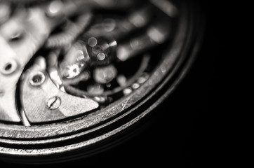 The mechanism of old antique pocket watches, Close up view of old clock's gears. selective focus