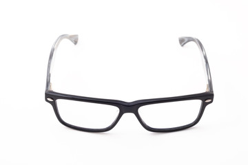 Rectangular black-rimmed glasses are located frontally on a white background. Isolated.