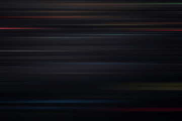 Light and stripes moving fast over dark background with motion blur effect