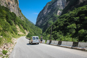 Travel by car through the high ridges of the Caucasus Mountains.