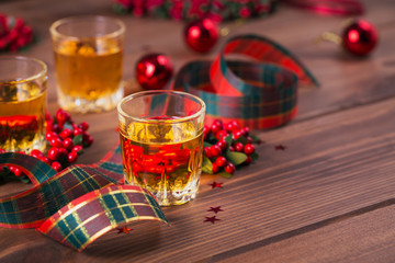 Whiskey, brandy or liquor shot and Christmas decorations