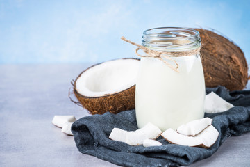 Coconut milk in glass jar. Vegan non dairy milk. 