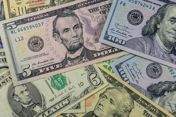 Obraz na płótnie Canvas Background of different american dollar banknotes