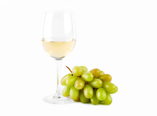 A glass of white wine with a bunch of green grapes on a white background. Alcoholic beverages.