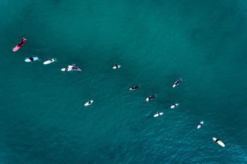Aerial view of surfers in the ocean at the Baleal beach in Peniche, Portugal