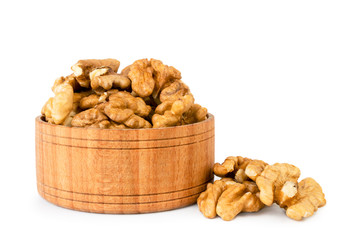Walnut in wooden plate on a white, isolated.