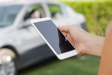 Women using smartphone in the car