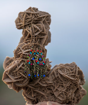 targui earrings exposed on a desert rose in algeria,
