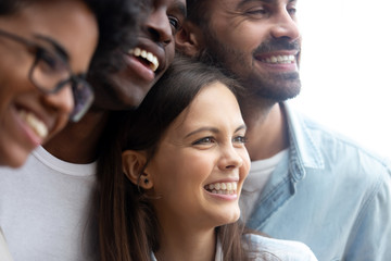 Happy smiling multiethnic friends having fun together close up, diverse multiracial young people, colleagues, students posing for photo, embracing, multiracial friendship concept