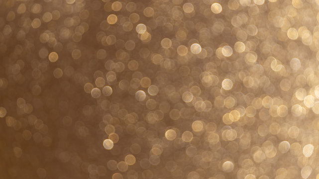 Magic bokeh gold background texture for party and celebration like new year Eve