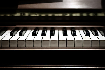 close the keys of a musical piano. romantic atmosphere. selective focus. for design and decor. concept of love backround texture.