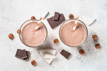 Chocolate coconut hazelnut milkshake or smoothie top view.