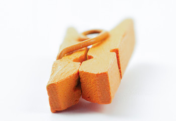 Colorful wooden clothespins on white background concept