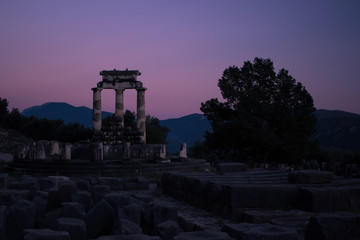 Fototapeta premium soft focus antique temple ruin from ancient Greece times in romantic darkness evening pink lighting after sunset 