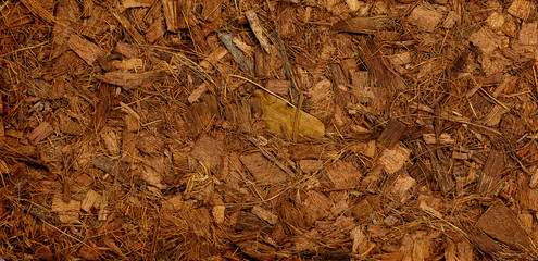 Compressed bale of ground coconut shell fibers (coir), surface background
